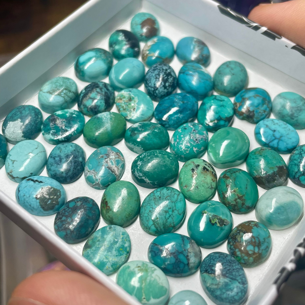 Box of random assorted natural Turquoise stone oval crystal cabochon gemstones stones