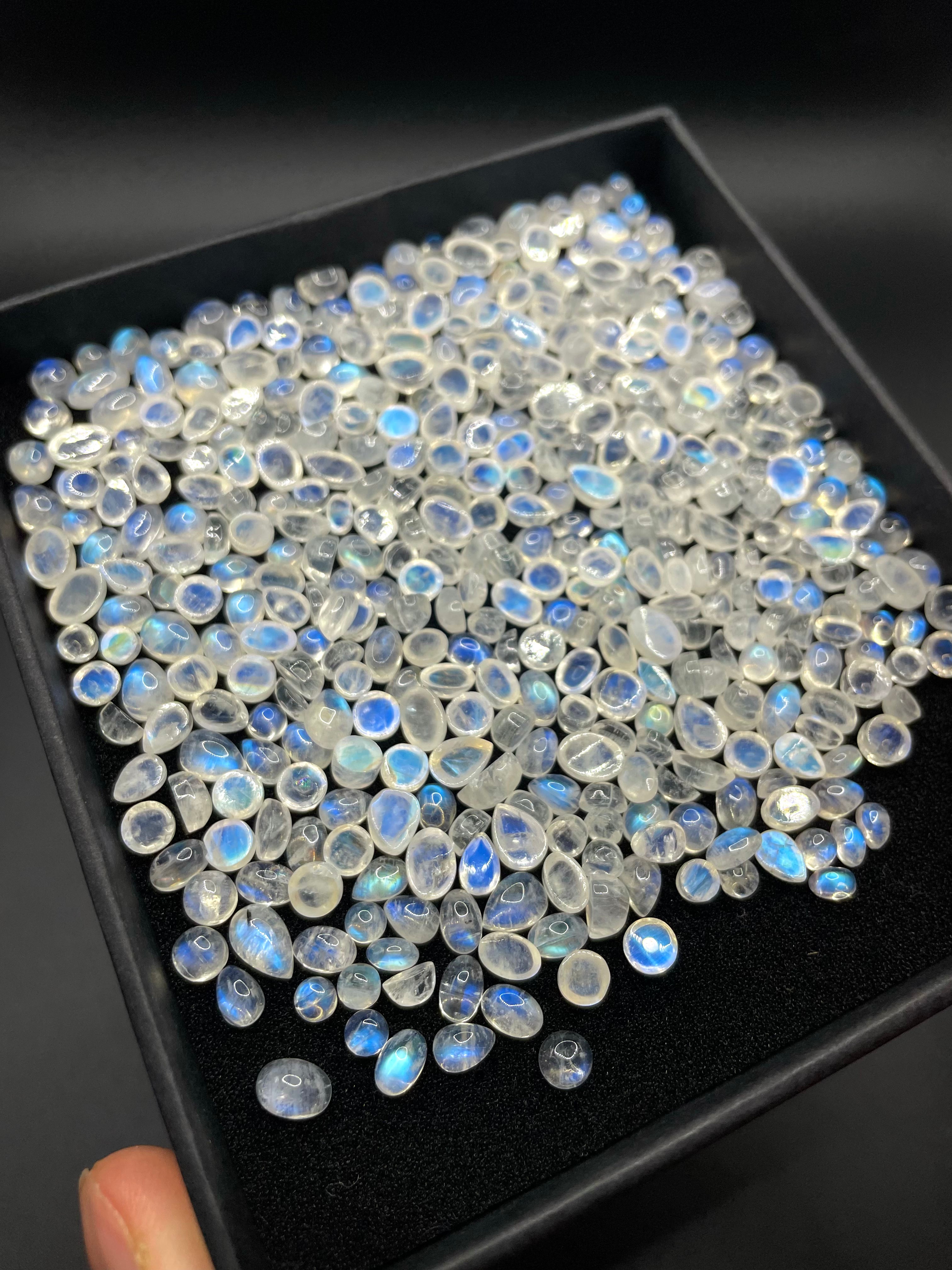 Box of random assorted natural Rainbow Moonstone crystal cabochon gemstones stones