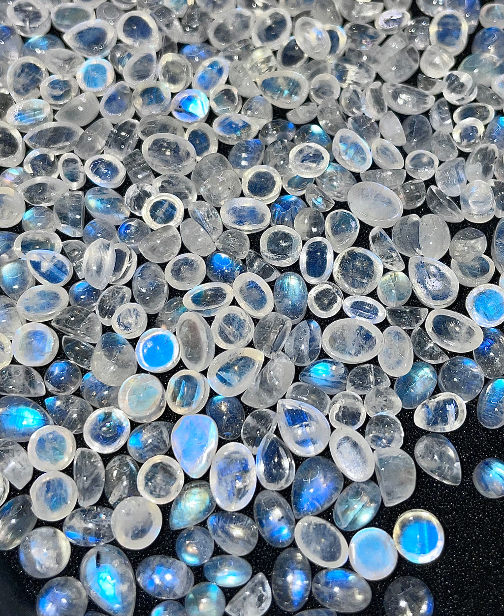 Box of random assorted natural Rainbow Moonstone crystal cabochon gemstones stones